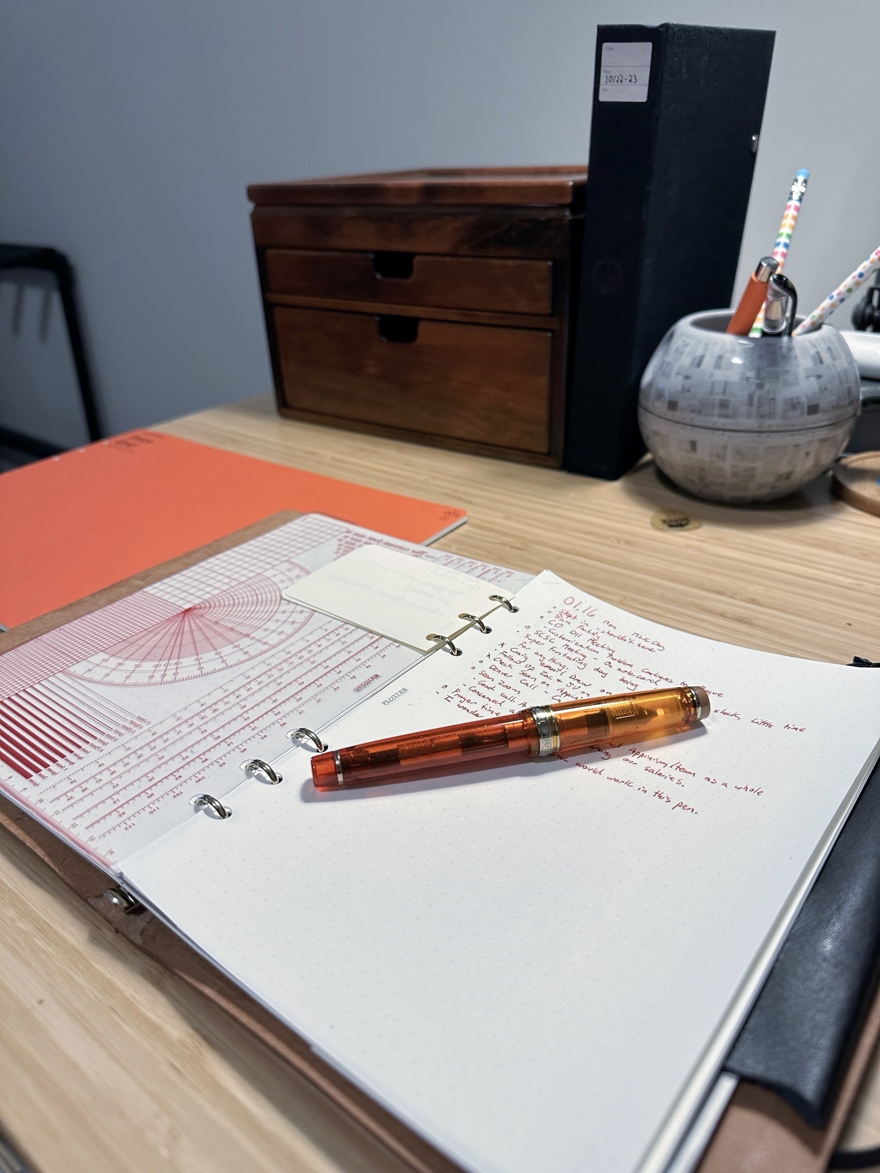 Notebook and fountain pen on desk